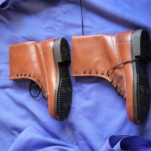 Reposhing brown boots size 9 1/2.  Name says Benelli exclusives made in Spain.